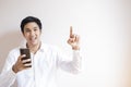 Asian education man reading books so looking tablet In office To prepare for the exam entrance to learn lesson training online