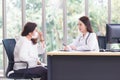 Asian elder woman consults with doctor about her symptom or health problem in examination room at hospital Royalty Free Stock Photo