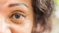 Asian elder women show her eyes and eyebrow tattoo Royalty Free Stock Photo