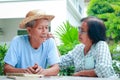 Asian elderly couple living at home taking care of each other happy with life . Royalty Free Stock Photo