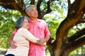 Asian elderly couple relaxing in the park Both of them smiled happily. Royalty Free Stock Photo