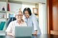 Asian couples working from home are happy to retire. Royalty Free Stock Photo