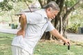 Asian elderly having pain on his back