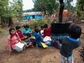 asian kids learning about laptop computer system at open area class in india January 2020