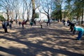 Asian elderly people practicing Tai Chi at public park