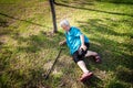 Asian elderly people with walking stick on floor after falling down in summer outdoor park,sick senior woman fell to the floor Royalty Free Stock Photo