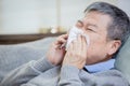 Asian elderly  sick man sneeze Royalty Free Stock Photo