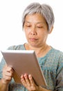 Asian elderly using tablet