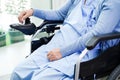 Asian elderly woman disability patient sitting on electric wheelchair in park, medical concept