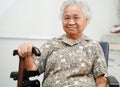 Asian elderly woman disability patient sitting on wheelchair in hospital, medical concept