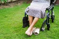 Asian elderly woman disability patient sitting on wheelchair in park, medical concept