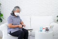 Asian elderly woman Measure fingertip oxygen