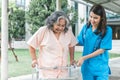 Asian elderly woman patient happy and smile, while doctor holding hands, encouraged and supported to her,