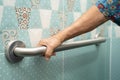 Asian elderly woman patient use toilet bathroom handle security in nursing hospital, healthy strong medical