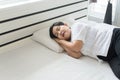 Asian elderly woman sleeping happy on bed and smiling her hands beside her head,Good dream,Daydream