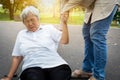 Asian elderly woman fell to the floor after tripped over something, female caregiver or daughter help care to her in nursing home, Royalty Free Stock Photo