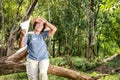 Asian elderly women trekking to travel Feeling tired and hot.