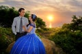 Asian elegance wedding couple ourdoor with sunset backgound Royalty Free Stock Photo