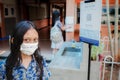 Asian elementary schoolgirl wearing face mask back to school again after covid pandemic
