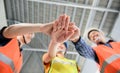 Asian Engineer and architect handshake at construction property site. Teamwork and Successful housing estate building Royalty Free Stock Photo