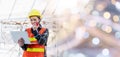 Asian engineer architect worker woman working at build construction site use laptop and talking with radio Royalty Free Stock Photo