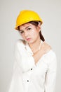 Asian Engineer girl with hard hat got back pain Royalty Free Stock Photo