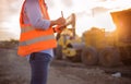 Asian engineer with hardhat using tablet pc computer inspecting Royalty Free Stock Photo