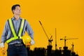 Asian engineer holding yellow helmet Royalty Free Stock Photo