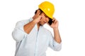 Asian engineer man cant hear his phone stop an ear Royalty Free Stock Photo