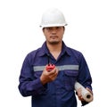 Asian engineer in safety uniform and white helmet holding project plan and walkie-talkie isolated on white background Royalty Free Stock Photo