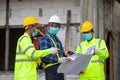 Asian engineer technician team introduction of workers to build a house in the construction site