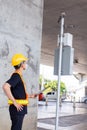 Asian engineer wearing hard hat and safety vest looking the copy space while holding tablet Royalty Free Stock Photo