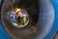 Asian engineer worker is examining the stainless galvanized metal sheet roll inside the warehouse factory for roofing industry Royalty Free Stock Photo