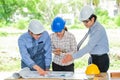 Asian engineers were consulted together and plan construction Royalty Free Stock Photo