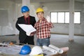 Asian engineers were consulted together and plan in construction site, engineering concept Royalty Free Stock Photo