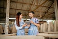 Asian enterpreneur couple chatting while working on a tablet together