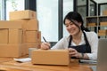 Asian entrepreneurs small business SME independent men work at home, online marketing, packing boxes, SME sellers Royalty Free Stock Photo