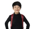 Asian ethnicity boy with backpack is smiling