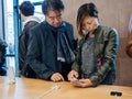 Asian ethnicity couple customers at Apple Store iPhone X