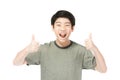 Asian excited boy in green-shirt giving thumbs-up Royalty Free Stock Photo