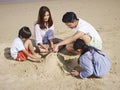 Asian family on beach Royalty Free Stock Photo