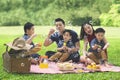 Asian family blows bubble soap in the park Royalty Free Stock Photo