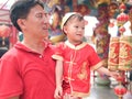 Asian family celebrating Chinese new year, Cute little 2 years old toddler boy child in traditional red Chinese suit at local Chin Royalty Free Stock Photo