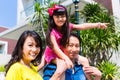 Asian family with child standing in front of home Royalty Free Stock Photo