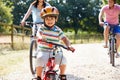 Asian Family On Cycle Ride In Countryside Royalty Free Stock Photo