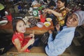 Asian family dining at Bac Ha Market in Vietnam, Southeast Asia