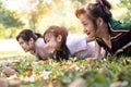 Asian family doing push ups for body on the gress at park in the morning,exercise together,beautiful mother,daughter,granddaughter