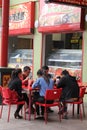 Asian couples are eating outdoor at a terrace in Chinatown, Adelaide, Australia