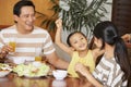 Asian family eating dinner