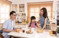 Asian family enjoy eating breakfast together in kitchen room at home Royalty Free Stock Photo